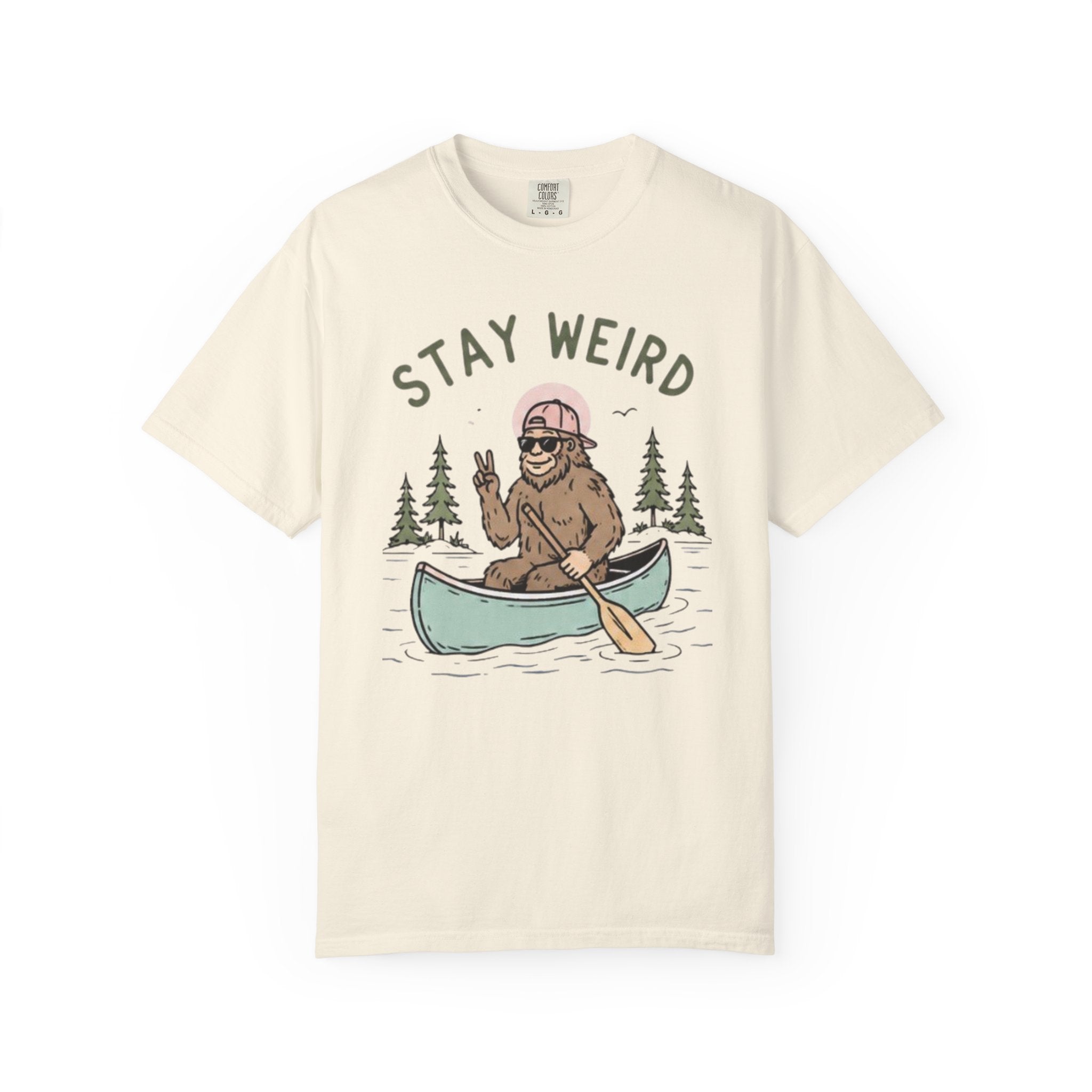 Stay Weird Canoe T-Shirt | Funny Bigfoot Paddling Outdoors Graphic Tee