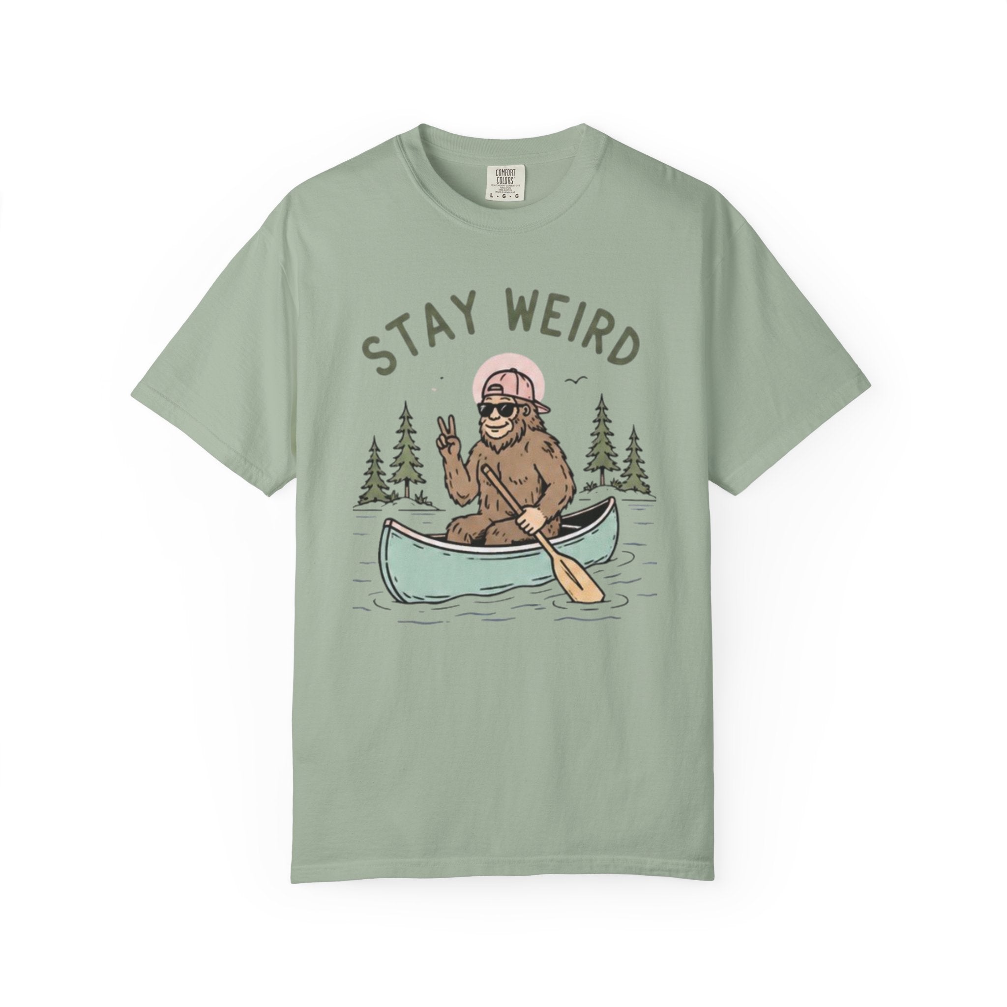 Stay Weird Canoe T-Shirt | Funny Bigfoot Paddling Outdoors Graphic Tee