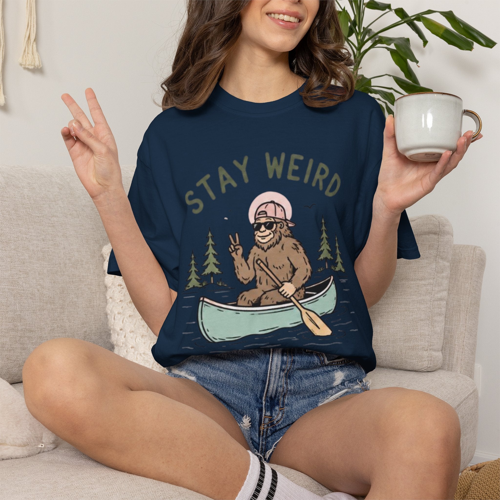 Stay Weird Canoe T-Shirt | Funny Bigfoot Paddling Outdoors Graphic Tee